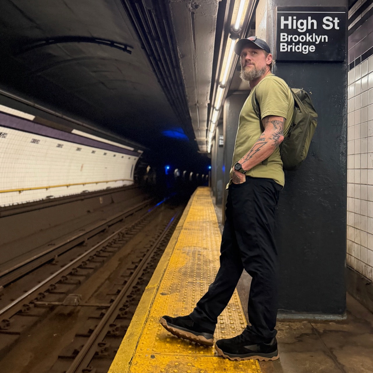 Mackall 45 Black + Gum shoes worn on a subway platform