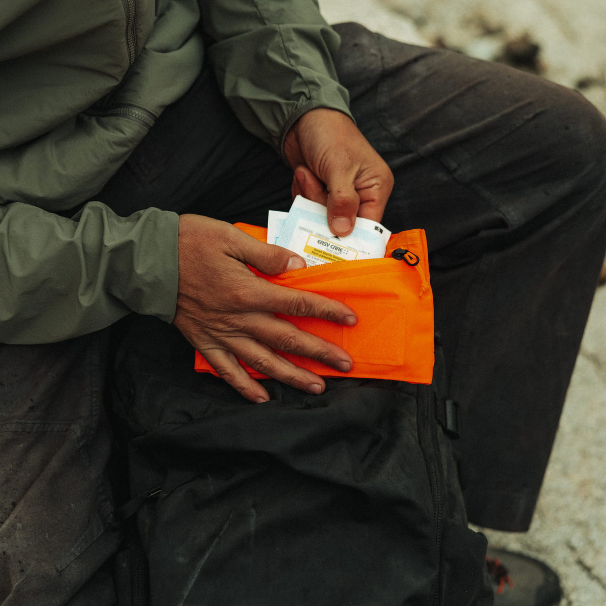 CIVIC Flat Pouch Hot Orange First Aid Kit in Hand