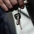 Hand holding keys with a glow rhino fob